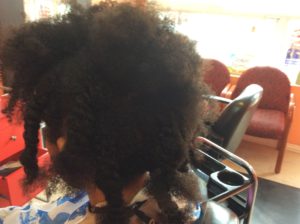 female with uncombed natural curly hair