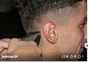 Young man getting a haircut.