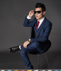 Young man wearing a blue suit.