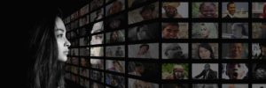 Wall of television monitors with pictures.