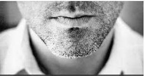 Male with shadow beard.