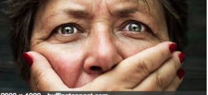 Shocked woman with hand over mouth.
