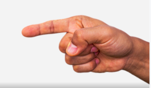Image of a man's hand pointing in an aggressive manner.