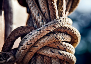 large braided brown rope tied in a knot.