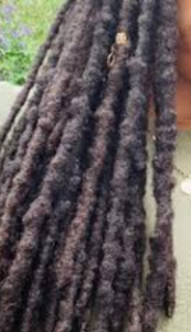 Image of dark brown dread with bumps.