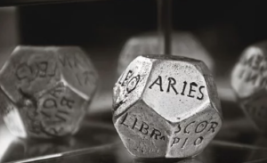 Dice with astrology signs on the sides.