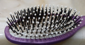 Purple paddle brush