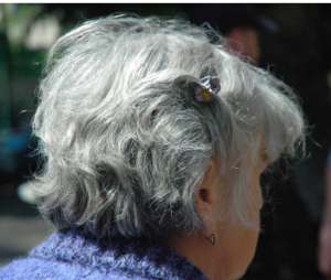 Back view of mature lady with short gray hair.