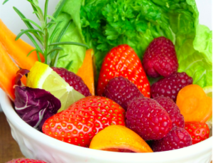 A bowl of various fruits and vegetables.