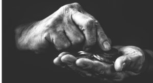 A pair of hands counting change.