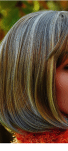 A light blonde wig with ultra light blonde highlights, cut in a bob style.