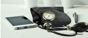 Photo of a phone, stethoscope and a pen.