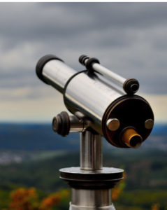 A silver telescope overlooking a countryside.