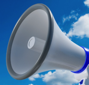 A loudspeaker with a blue sky in background.