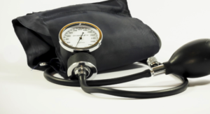 A folded black blood pressure monitor .