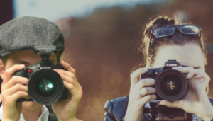 Photographers taking photos with camera at their eye.