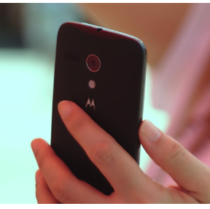 A person's hand holding a cell phone.