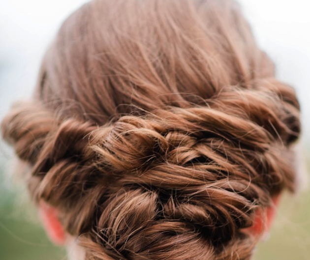 Copper hair in a twisted updo.