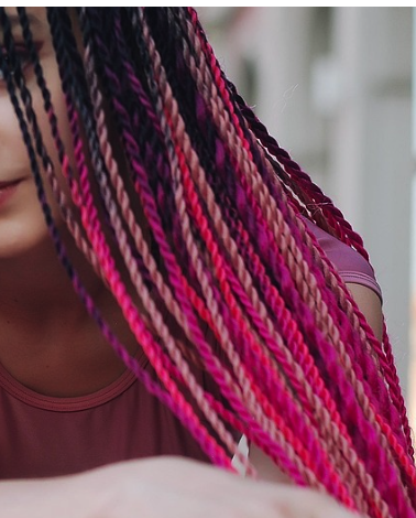 Red and pastel pink single braid extensions.