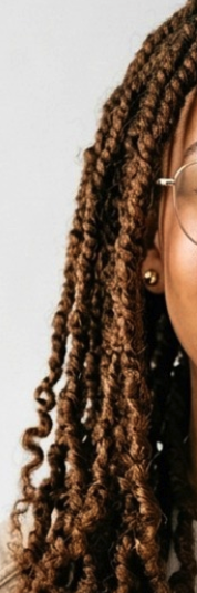 Site view of twist hair extensions in dark copper.
