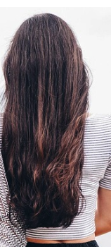 Waist-length dark-brown hair.